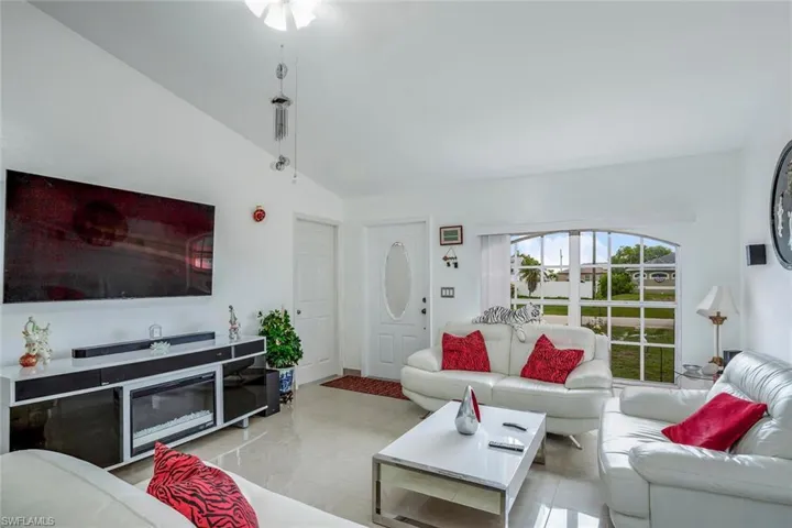Living area featuring vaulted ceiling
