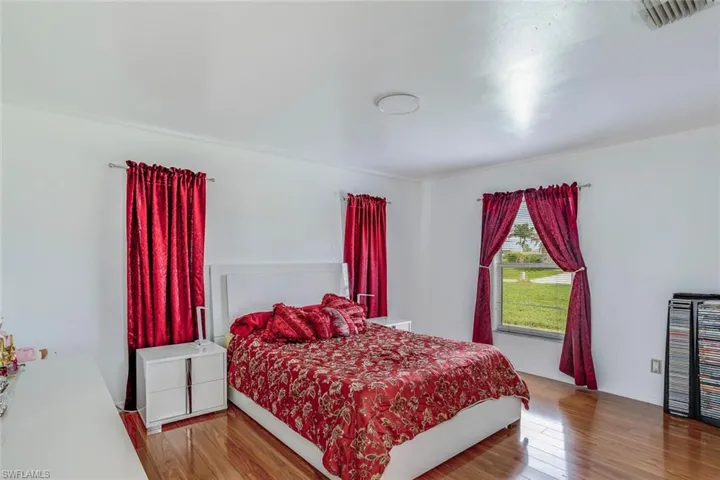 Bedroom with wood finished floors