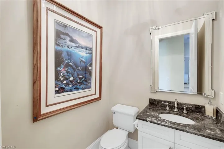 Office with built in desk, dark wood-style floor, crown molding, and recessed lighting