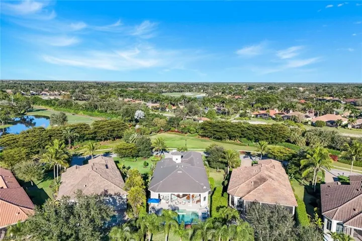 Aerial perspective of suburban area featuring a tree filled landscape