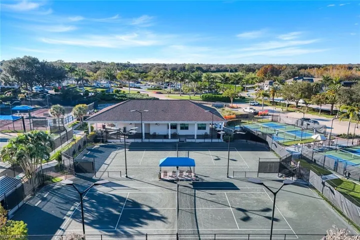 View of community featuring tennis, pickleball