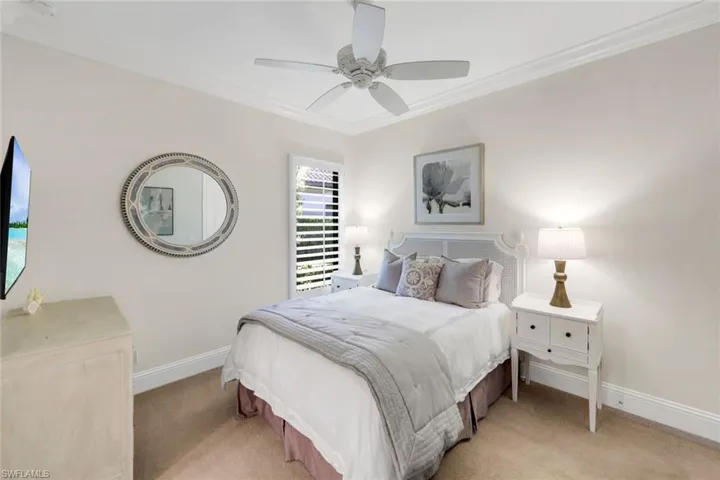 2rd Bedroom featuring king bed, carpet flooring, a ceiling fan, and crown molding