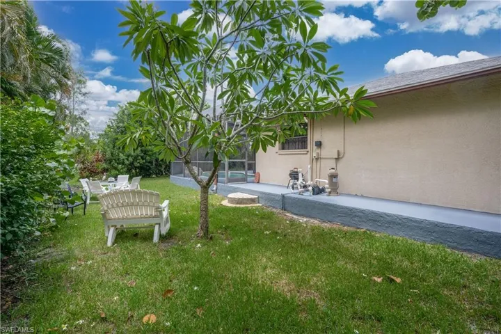 View of yard with a lanai and a patio