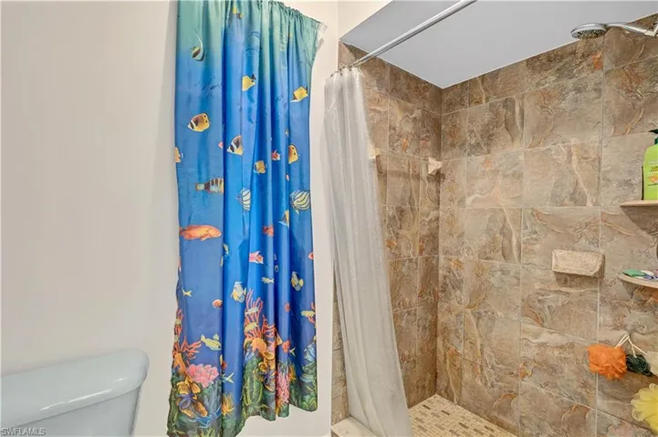 Bathroom featuring toilet and walk in shower