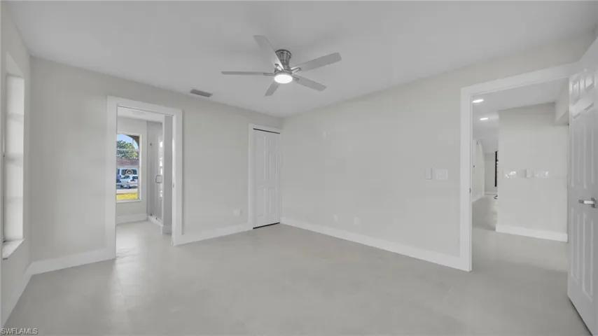 Unfurnished bedroom with baseboards and a ceiling fan
