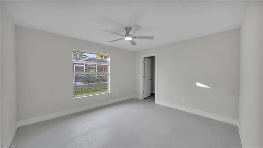 Unfurnished bedroom with a closet and ceiling fan