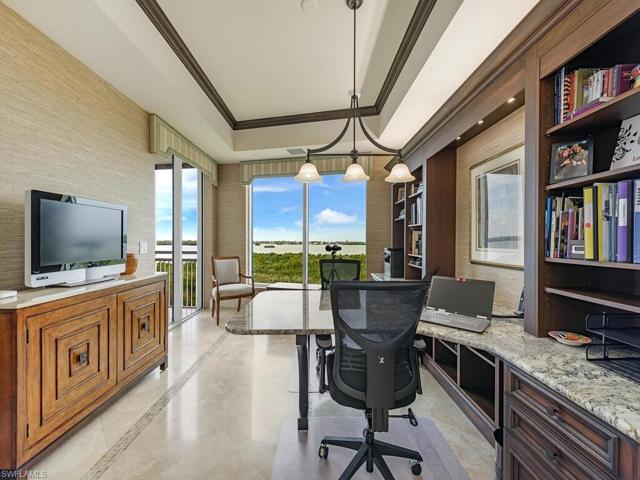 Still working - no problem!  This den is equipped to handle his/her workspaces with plenty of storage and entrance to screened lanai.