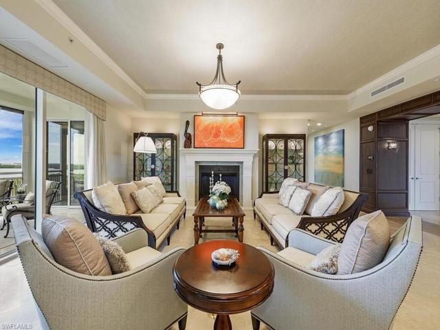 Spacious living room with gas fireplace.  Neutral decor and furnishings.
