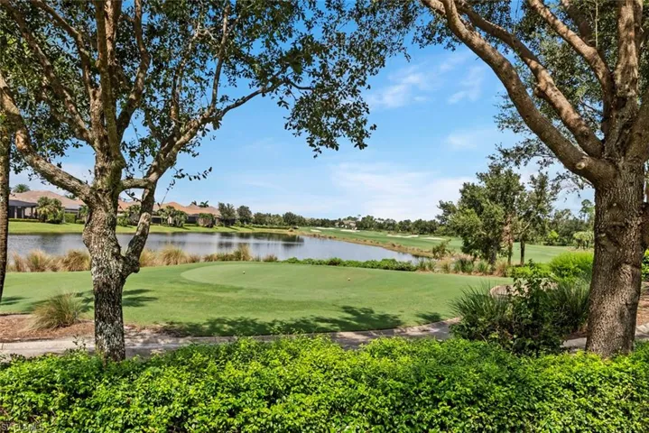 View of property's community featuring a yard and a water view