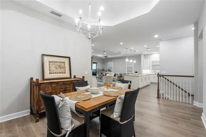 Dining room featuring light hardwood / wood-style flooring and a notable chandelier
