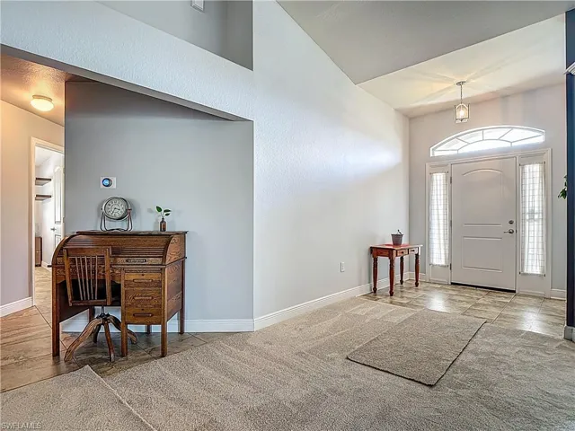 Welcome In! The entrance leads you into the great room area with new carpeting and to hallway with guest bedrooms and baths.