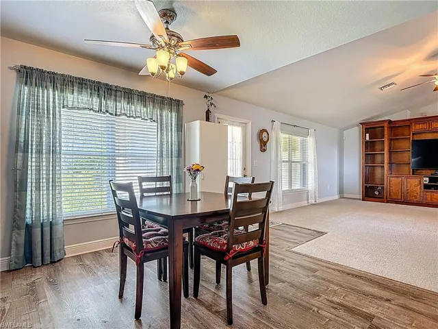 The dining area overlooks the fenced back yard.