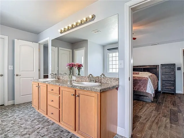 Two doorways access the ensuite bath