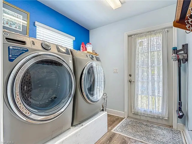 Raised Washer & Dryer for convenience & easy access.  Doorway leads to backyard...