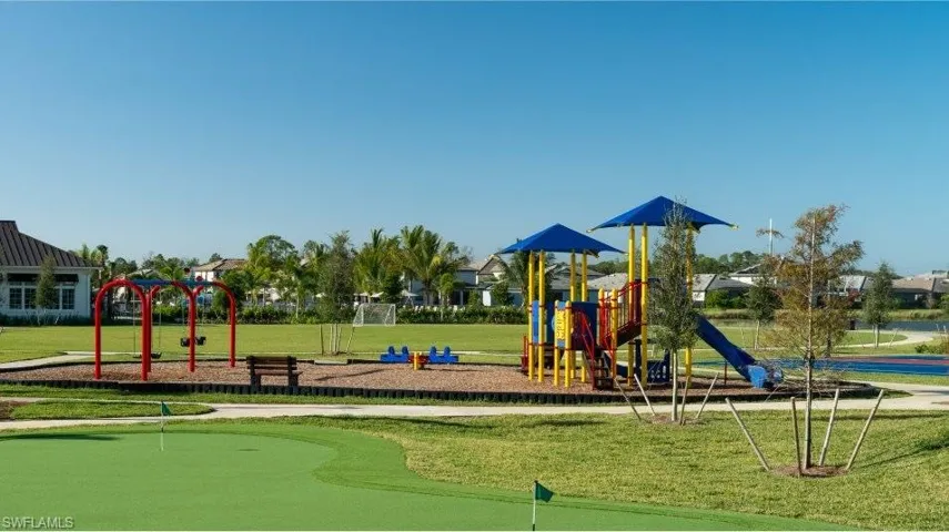 Community playground featuring a yard