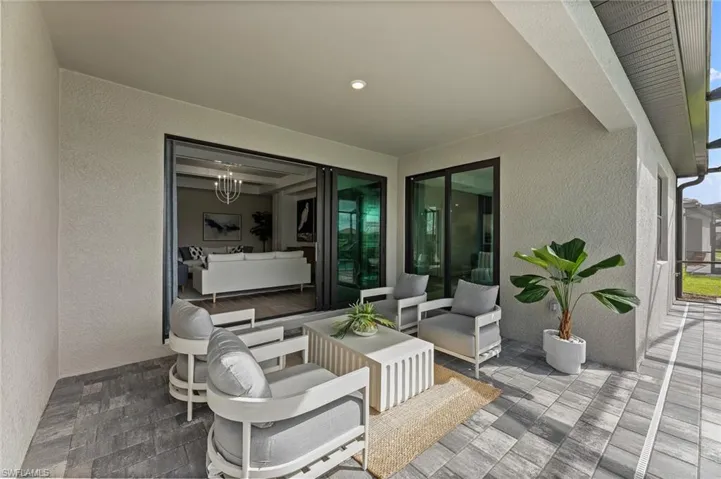 View of patio with an outdoor hangout area
