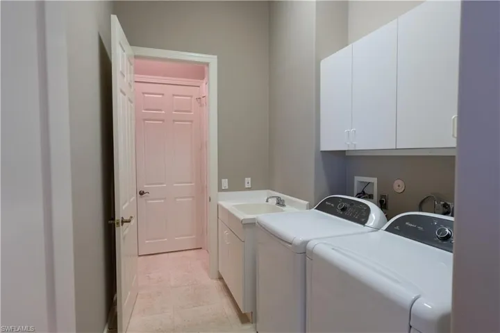 Large Laundry Room with Hanging Cabinets and Laundry Sink Cabinet!