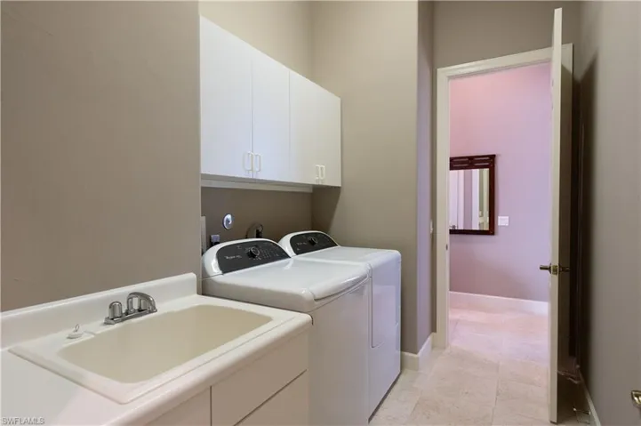 Large Laundry Room with Hanging Cabinets and Laundry Sink Cabinet!
