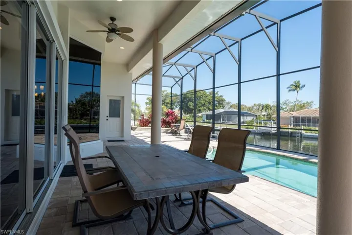 Cool Covered Lanai with Table and Chairs for Outside Dining!
