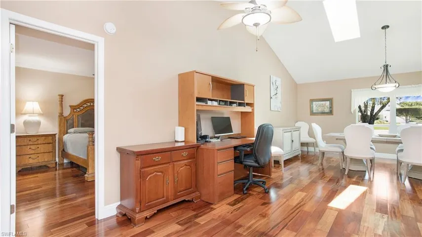 Office area (which has potential of creating an additional room) featuring ceiling fan and wood flooring