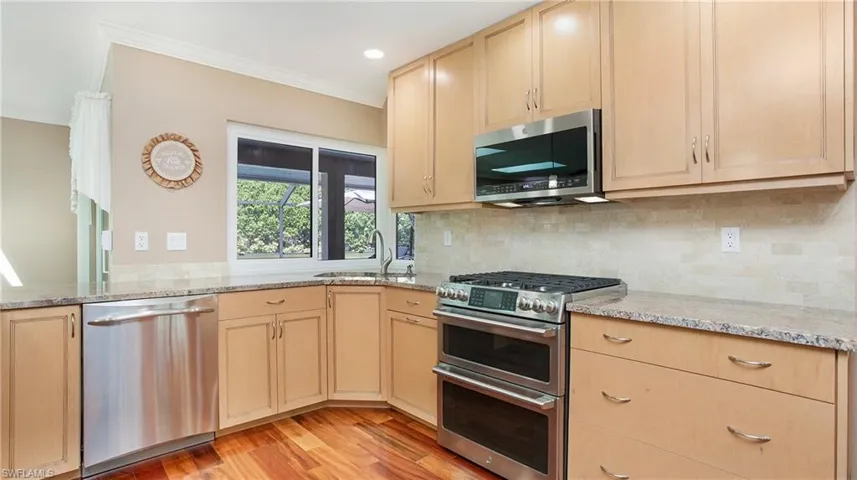 Kitchen with GE Cafe duel fuel range with double oven