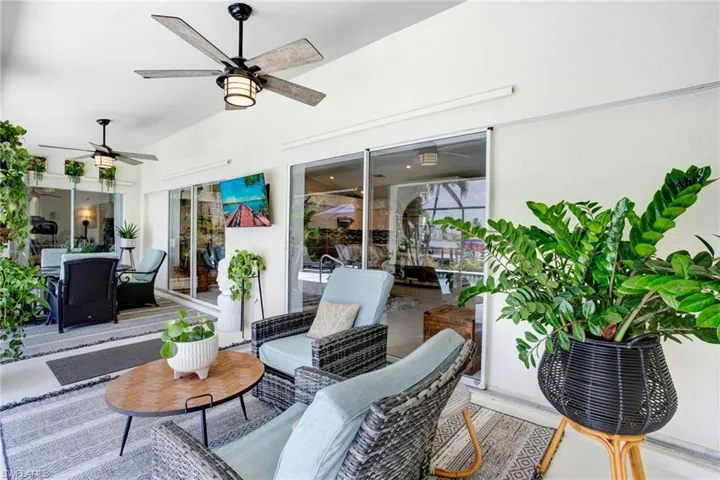 View of terrace with ceiling fan and an outdoor living space