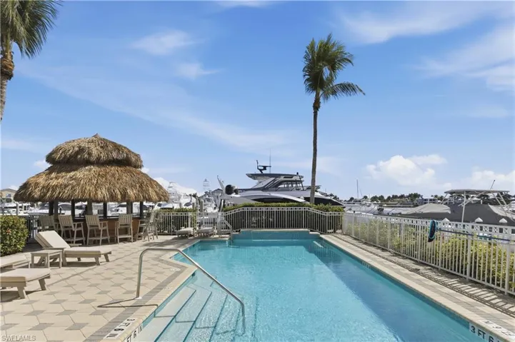 Community pool featuring a gazebo and a patio area