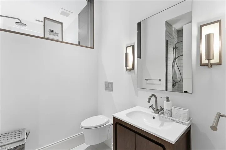 Full bath featuring vanity and a shower