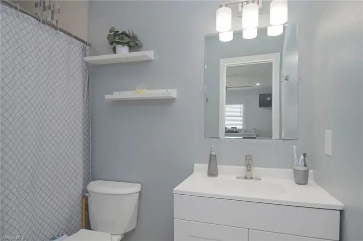 Bathroom with vanity and toilet