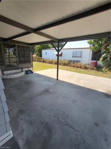 View of patio featuring a carport
