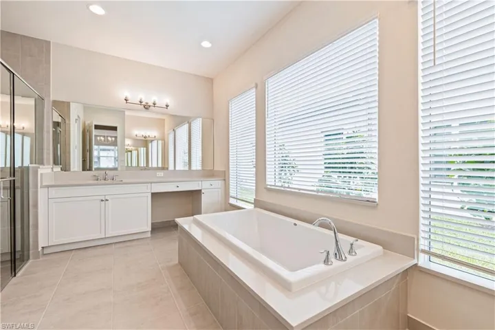 Features separate tub and shower