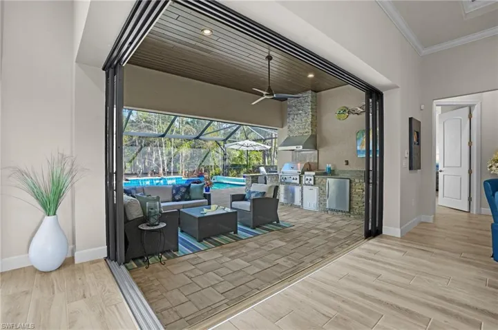 Zero corner door leads to the outdoor space with elegant wood ceiling