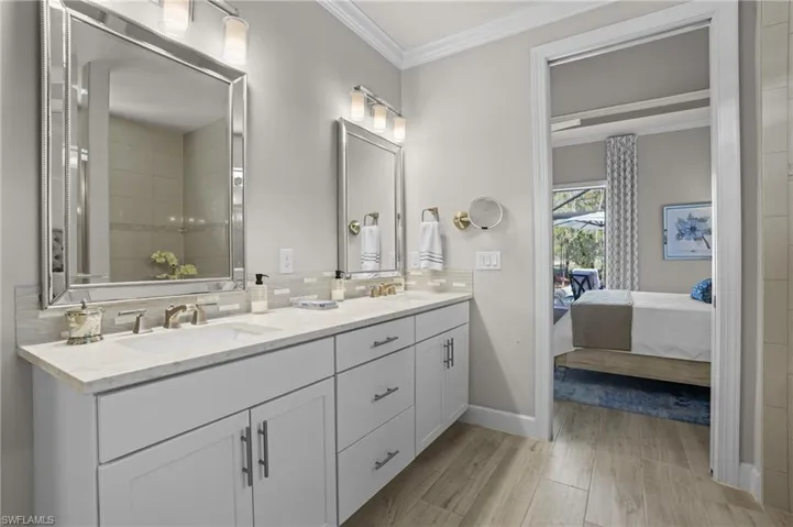Elegant primary bath with shower and voluminous walk-in closet