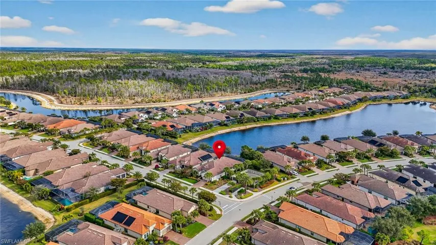 Aerial view of residential area with a large body of water