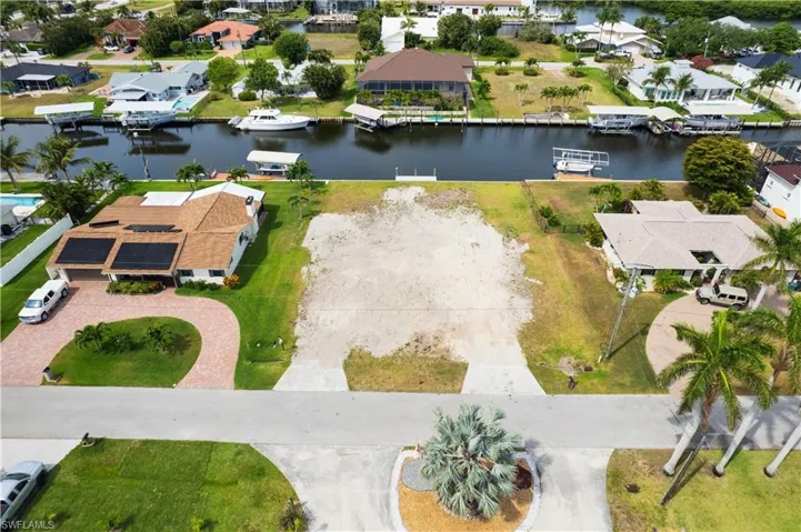 Aerial perspective of suburban area with a large body of water