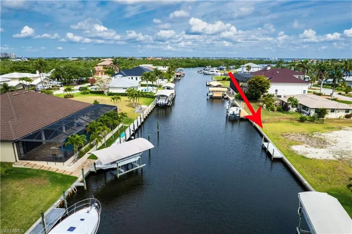 Aerial view of residential area featuring a large body of water