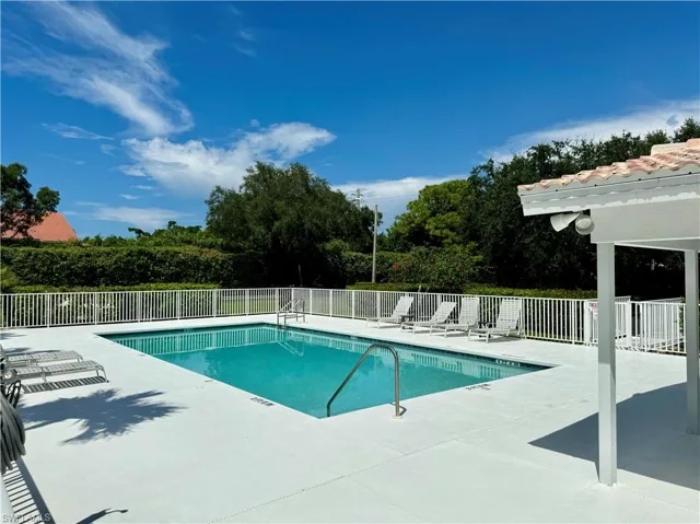 Community pool featuring a patio area