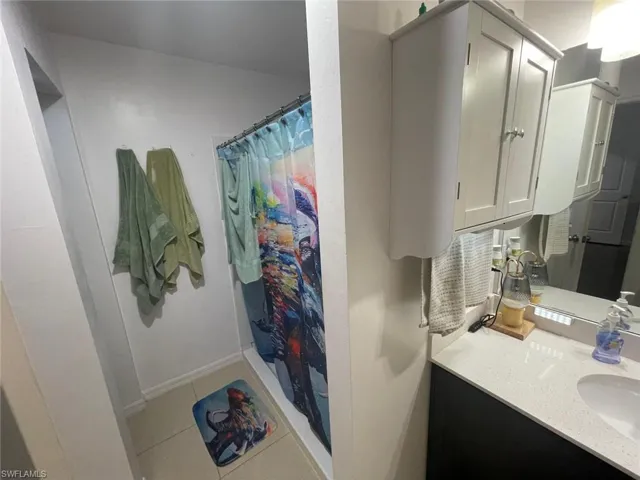 Bathroom with vanity and tile patterned flooring