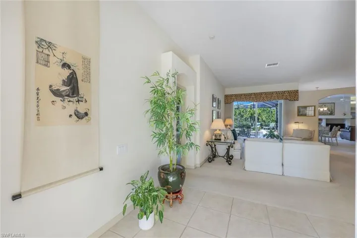 Living room featuring light colored carpet