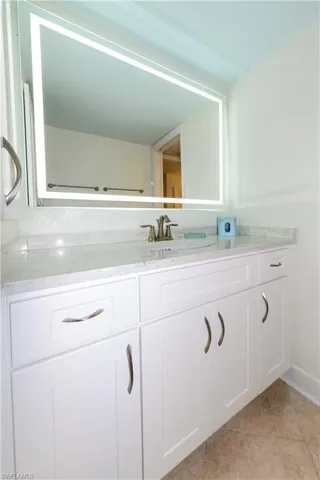 Bathroom featuring vanity and tile patterned flooring