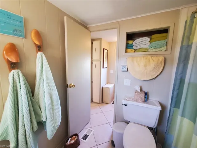 Main bathroom features a shower tub combination.