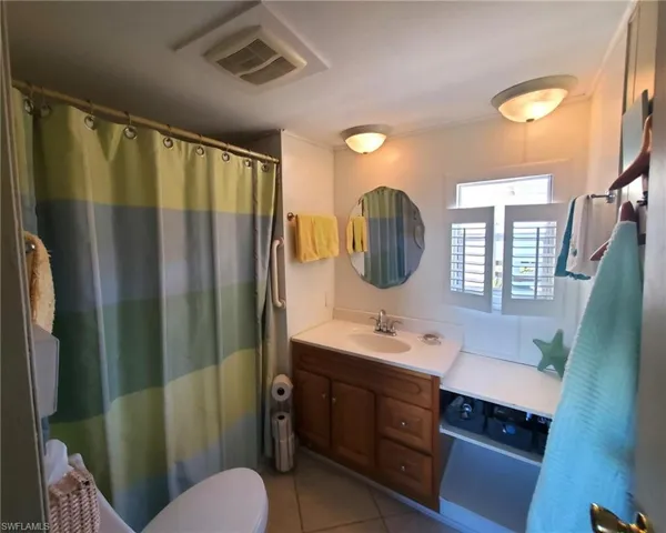 Hall bathroom features a shower tub combination.