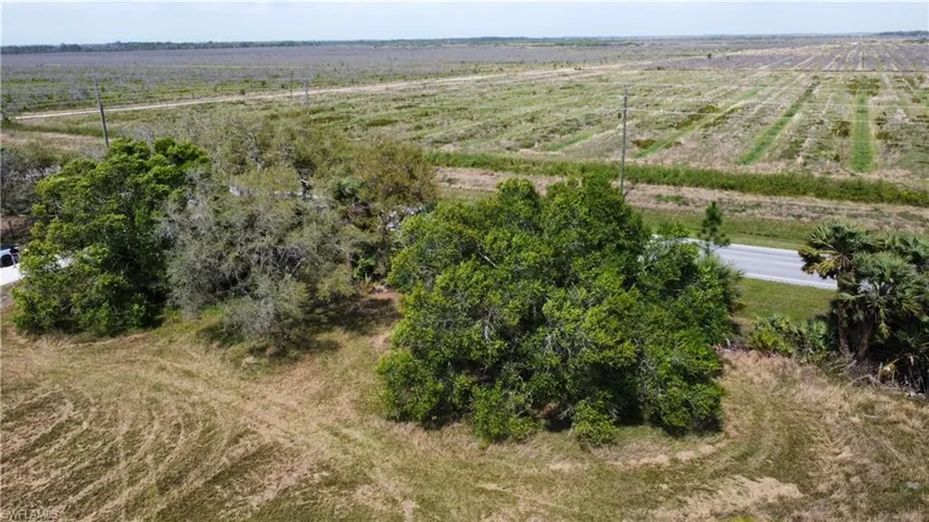 Birds eye view of property with a rural view