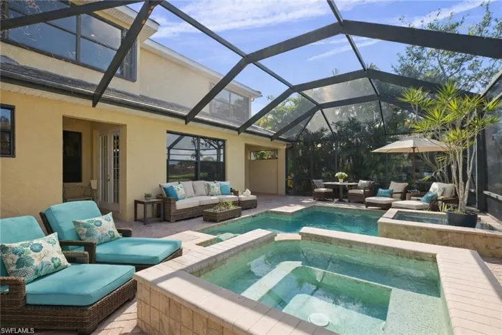 Combined pool / hot tub with outdoor lounge area, a sunroom, a lanai, and a patio area virtually staged