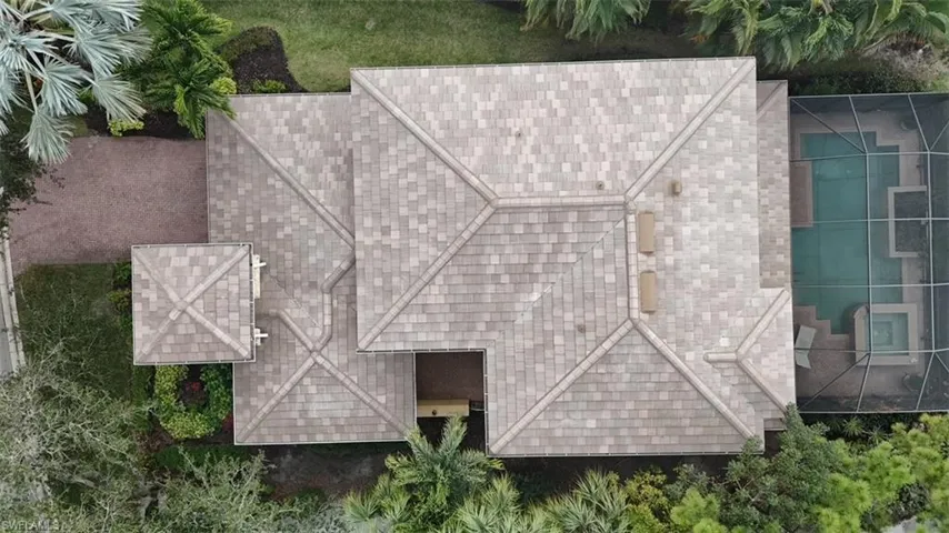 Brand New Roof 2026 Aerial view of home with caged pool