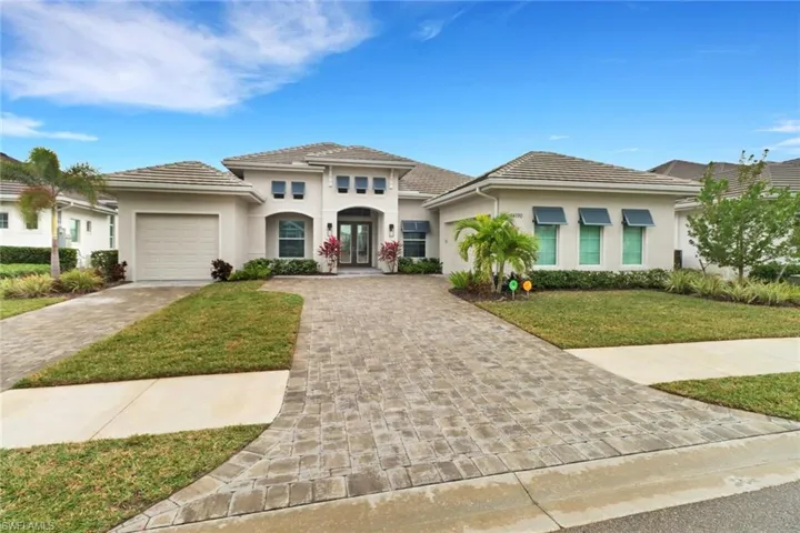 View of front of home featuring 3 car garage.