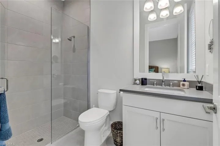 Bathroom featuring vanity and a glass enclosed shower