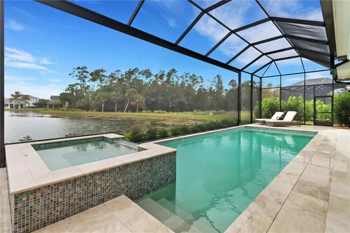 Beautiful Stock custom salt water pool and in ground spa with a private water view.