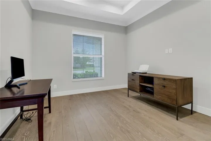 Study/Office space with light wood floors.