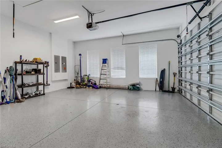 Two car garage featuring epoxy floors.